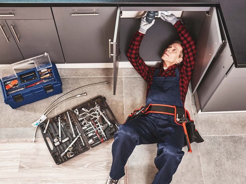 tools-case-top-view-of-seniour-handyman-repairing-resize.jpg